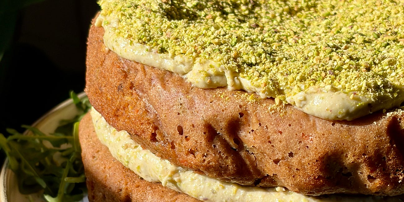 The best gluten-free carrot cake with a creamy pistachio icing