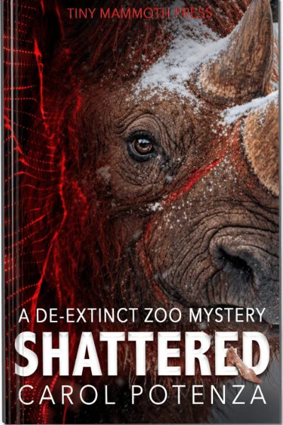 Book cover for Shattered with the head of a woolly rhino looking out at the viewer and a digital flow or red fabric on the left hand side Book cover for Shattered with the head of a woolly rhino looking out at the viewer and a digital flow or red fabric on the left hand side