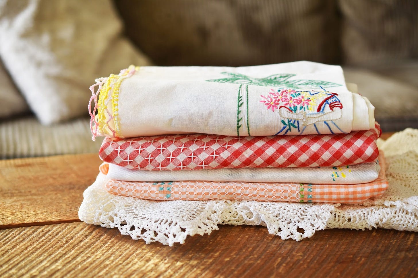 stack of vintage tablecloths
