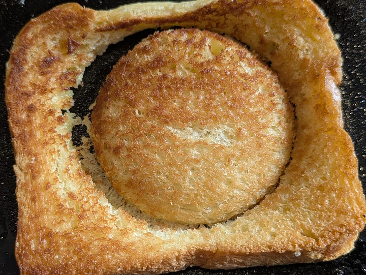 One eyed toast, cutting the hole with a cup.