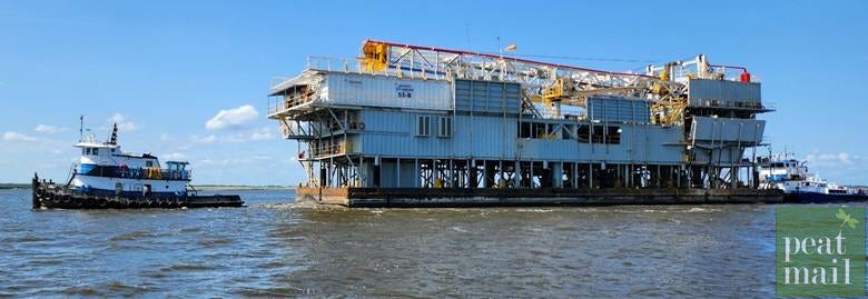 A large building on a platform in the water

AI-generated content may be incorrect.