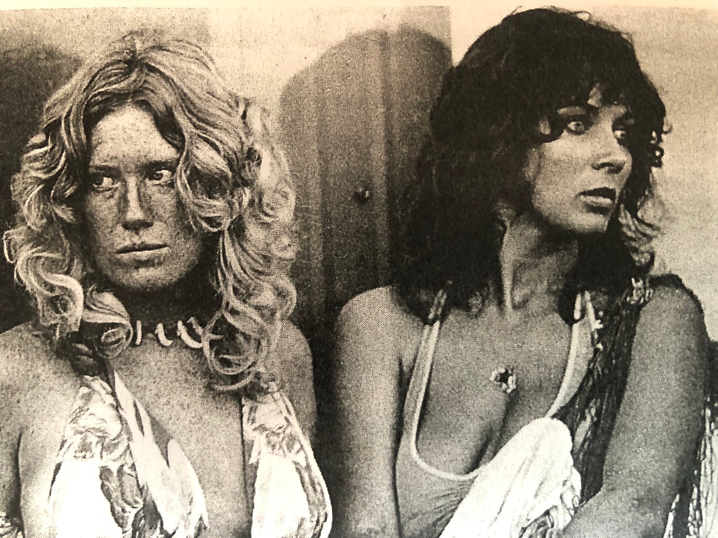 A blonde and a brunette in halter tops