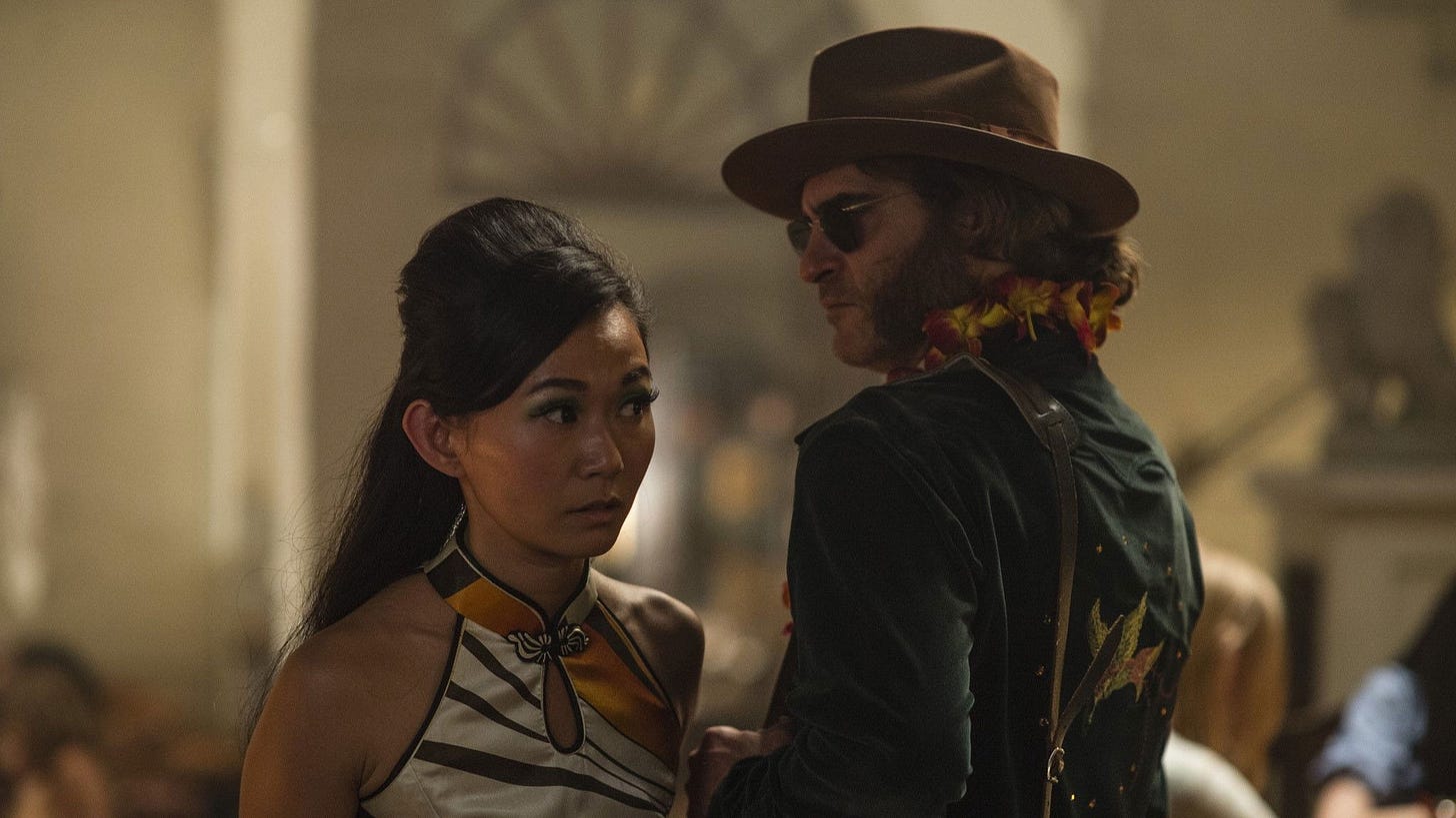Inherent Vice | Still features Joaquin Phoenix as Doc Sportello and Hong Chau as Jade. Inherent Vice | Still features Joaquin Phoenix as Doc Sportello and Hong Chau as Jade.
