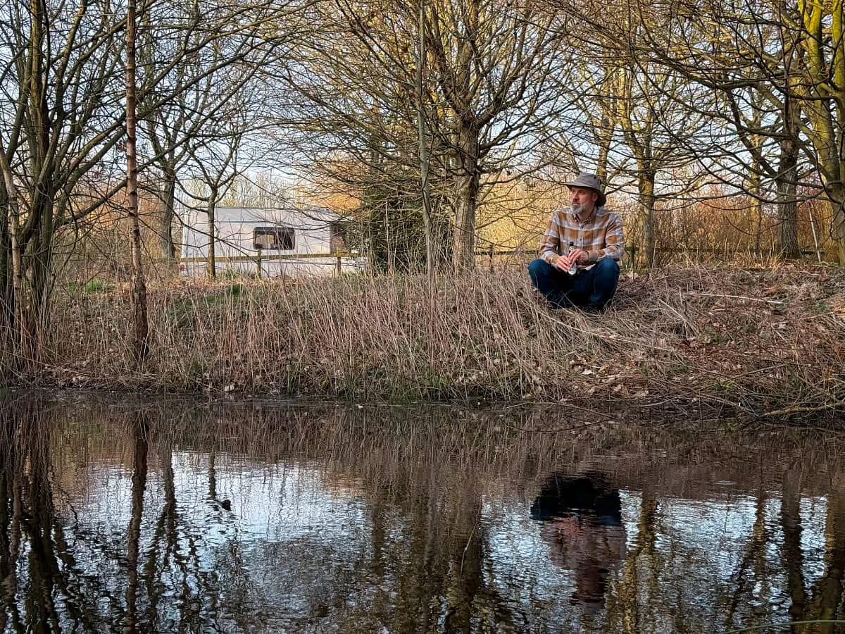 Me sat by our pond with the caravan almost hidden in the trees Me sat by our pond with the caravan almost hidden in the trees