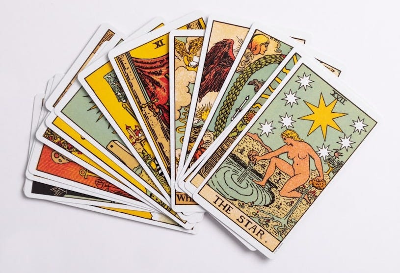 a deck of tarot cards on a white surface