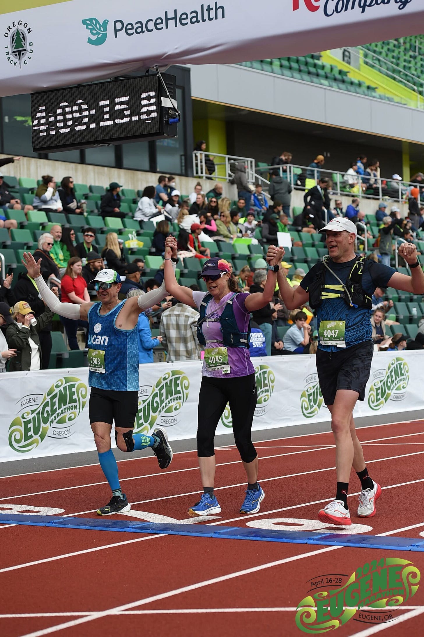 Crossing the finish line at the Eugene Marathon - end binge eating
