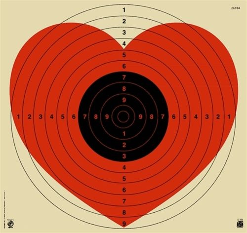 This may contain: a pink heart target with numbers in the center and an arrow on it's side
