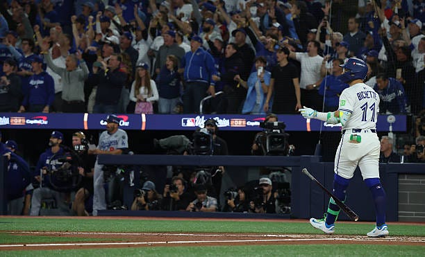 Second baseman Bo Bichette of the Toronto Blue Jays watches the flight of his three run homer as the Toronto Blue Jays fall to the Los Angeles...