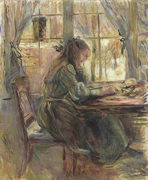 Young girl at table Young girl at table
