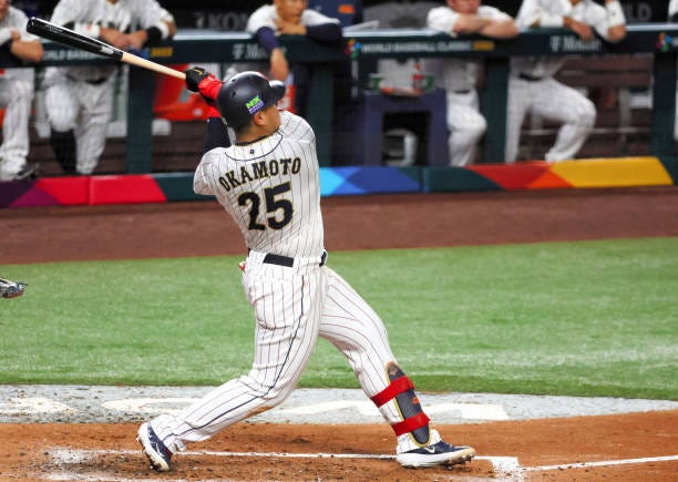 Kazuma Okamoto of Team Japan hits a solo home run in the fourth inning during the World Baseball Classic Championship between USA and Japan at...