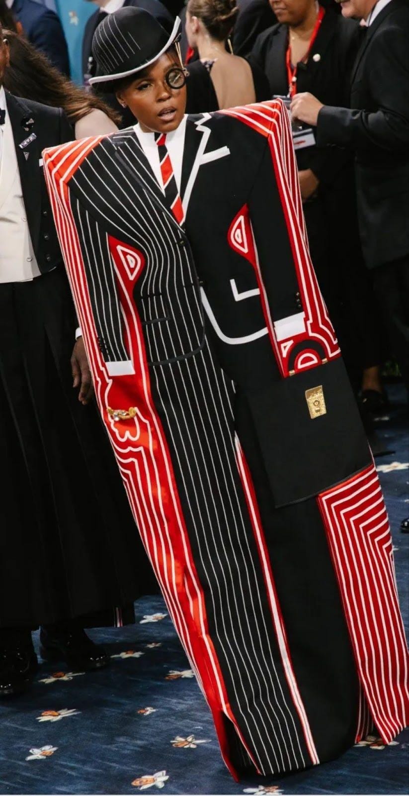 A person wearing a suit

Description automatically generated