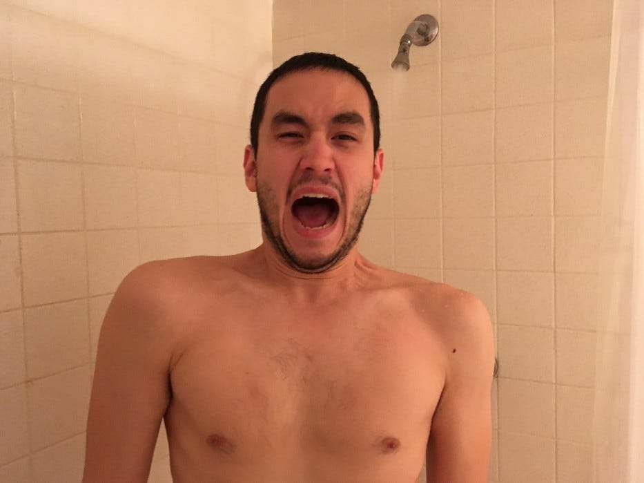 John taking a cold shower
