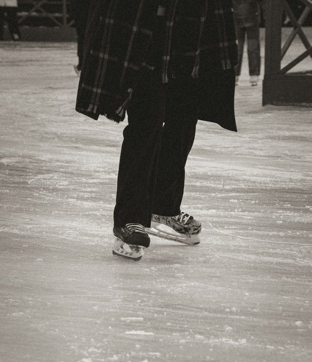 a black and white photo of a person on a skateboard