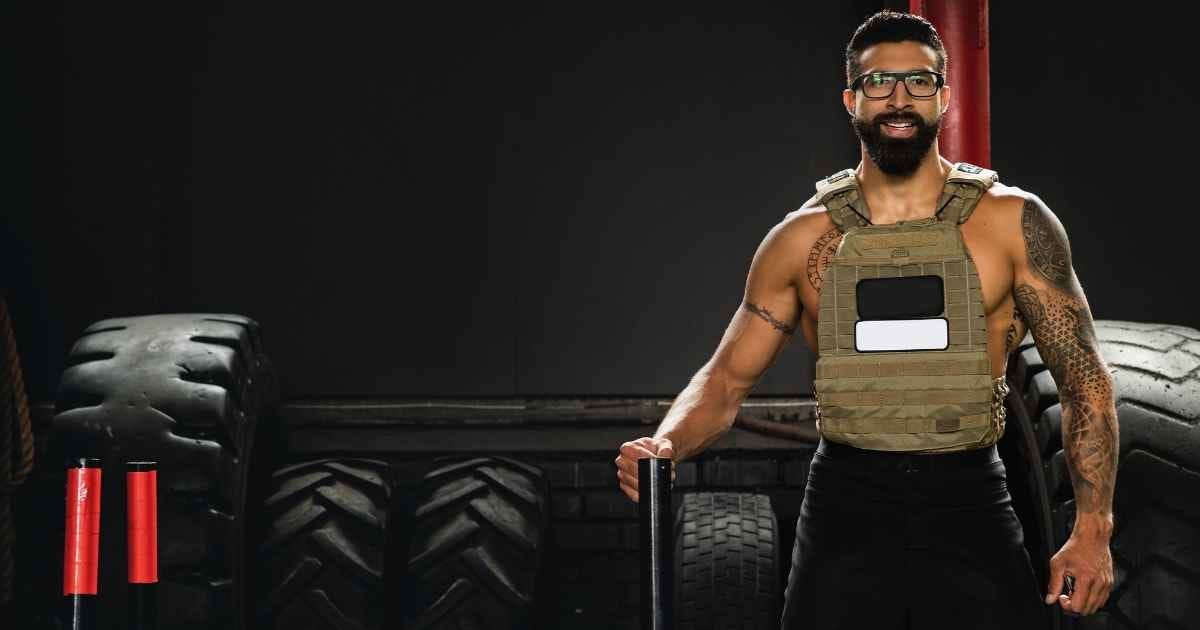 Guy in the gym stood next to a prowler sled Guy in the gym stood next to a prowler sled