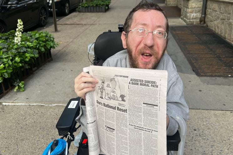 Dovie Eisner holds up his article in the New York Post. Dovie Eisner holds up his article in the New York Post.