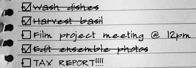 Handwritten checklist when WFH with some items crossed off. Handwritten checklist when WFH with some items crossed off.