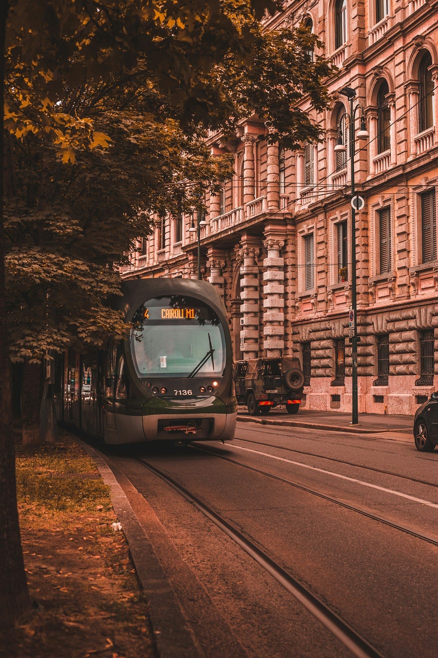 A tram car rolling along an electric track. Sustainable public transportation is helpful for the environment and helps reduce traffic on the roads.