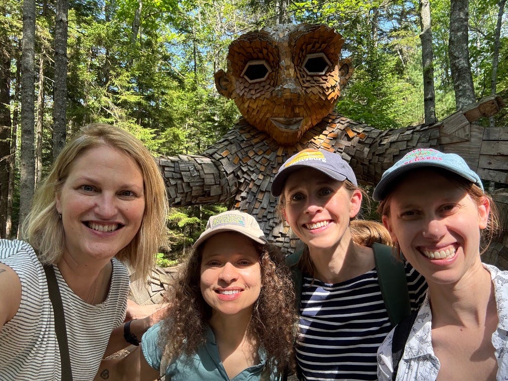 K. Woodman-Maynard and her friends: Kelsey Ervick, Beth Spencer, and Nicole Kelner pose in front of a troll statue on a creative retreat in Maine. K. Woodman-Maynard and her friends: Kelsey Ervick, Beth Spencer, and Nicole Kelner pose in front of a troll statue on a creative retreat in Maine.