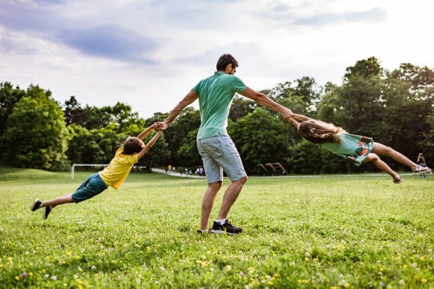 Dad Spinning Child Stock Photos, Pictures & Royalty-Free ...