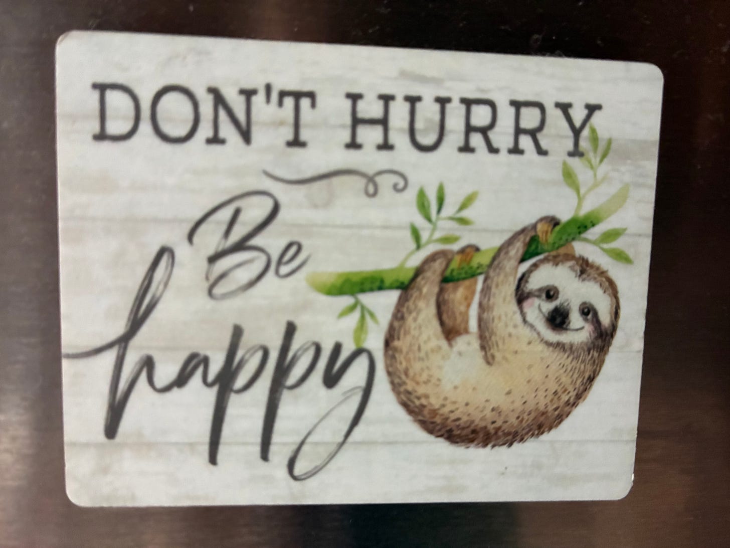 image of sloth with the words "Don't hurry, be happy"