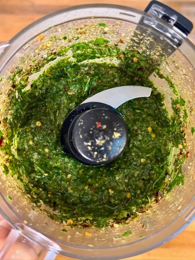 bright green chimichurri sauce in a food processor bright green chimichurri sauce in a food processor