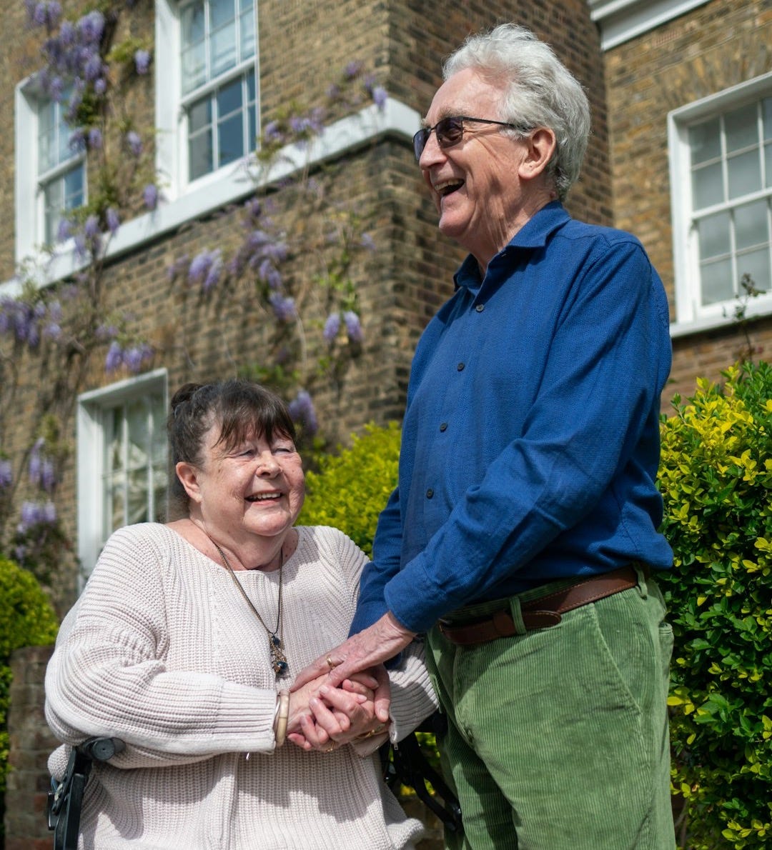 a man and a woman standing outside