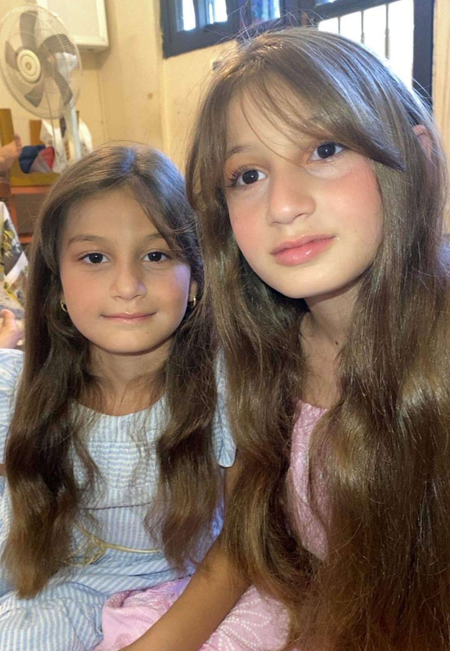The daughters of Mohammad Rida Taqi, who were killed along with their two sisters by an Israeli airstrike on the family home in the village of Irkay in southern Lebanon