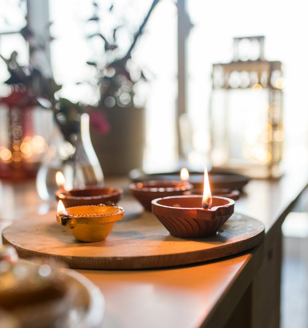 a wooden table topped with bowls filled with food a wooden table topped with bowls filled with food