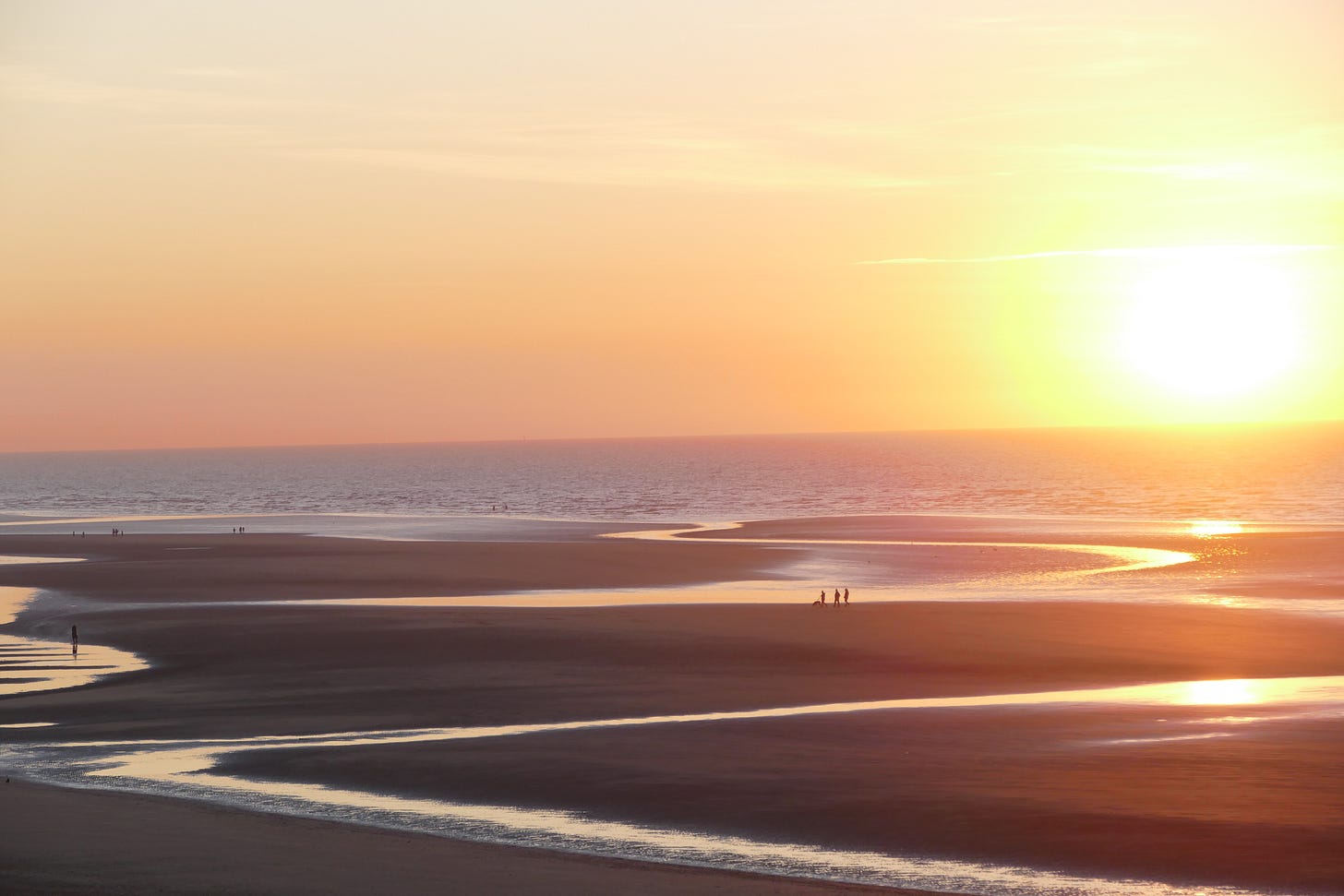 Golden Sunset Over a Wide Sandy Beach Golden Sunset Over a Wide Sandy Beach