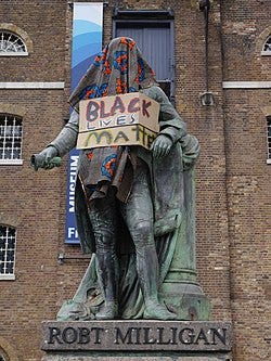 File:Statue of Robert Milligan, West India Quay on 9 June 2020 - statue covered and with Black Lives Matter sign 03.jpg