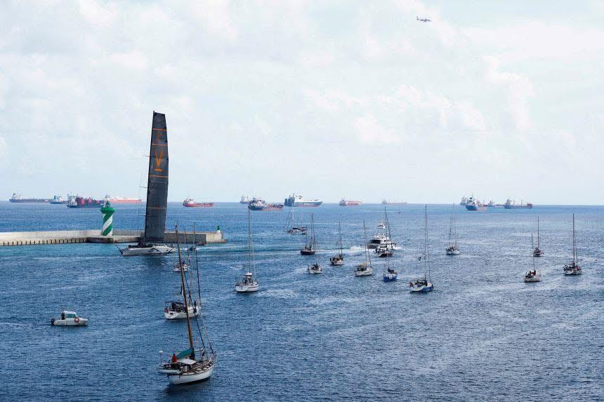 May be an image of 1 person, boat racing, submarine, sail, sailboat and ocean