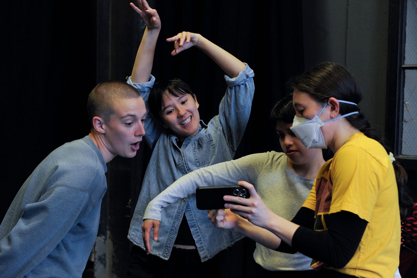 dancers looking at phone dancers looking at phone