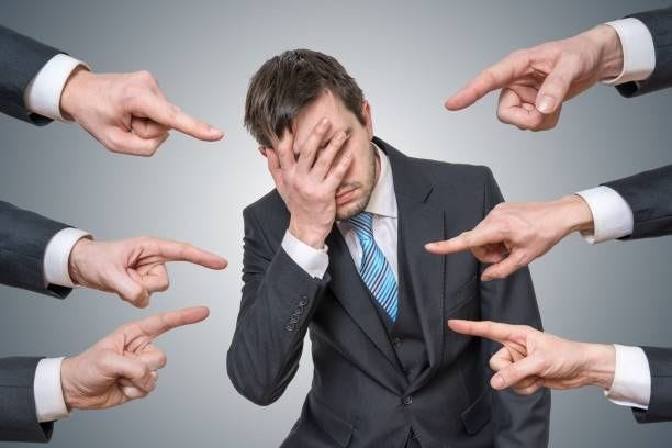 Many hands are pointing at man and blame him. Many hands are pointing at man and blame him. finger pointing blame stock pictures, royalty-free photos & images