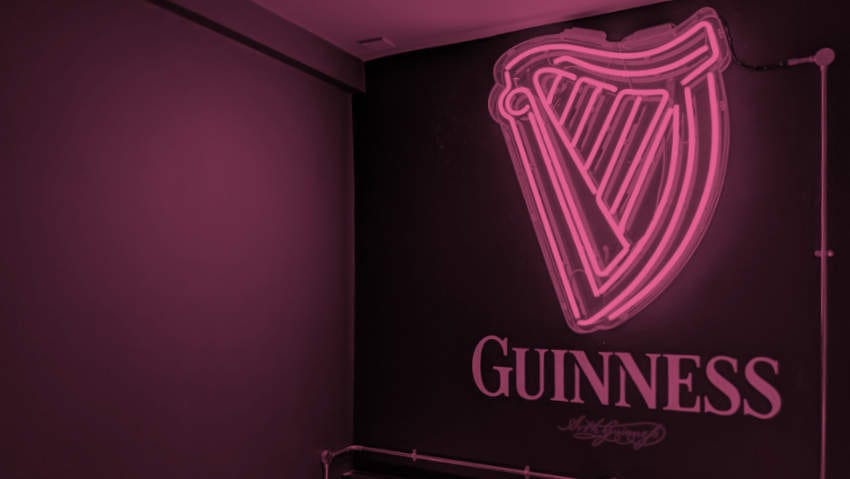 The Guinness logo in neon.