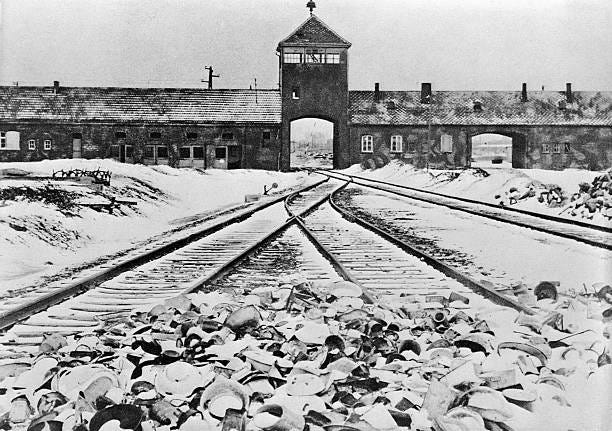 Entrance to the German concentration camp of Auschwitz-Birkenau in Poland. Undated B/W photograph.