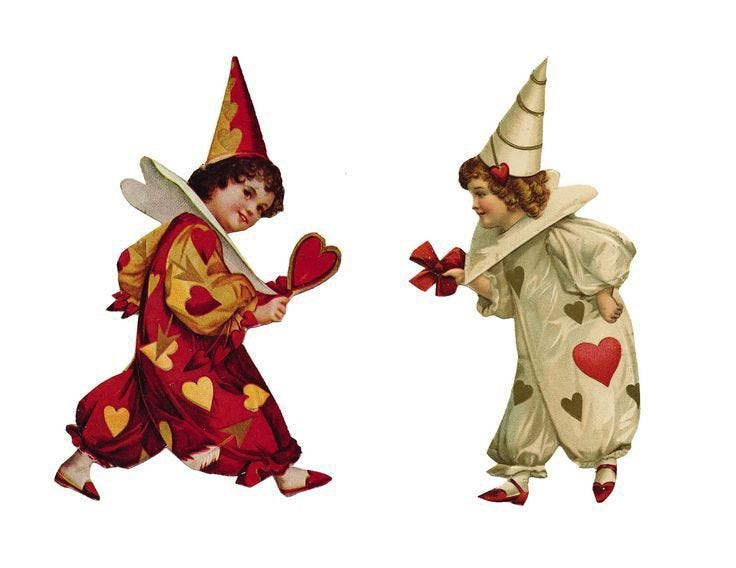 This may contain: two children dressed in costumes with hearts on their hands and one holding a heart shaped object