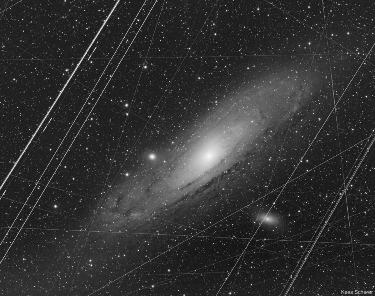 The Andromeda Galaxy before artefact removal, with airplane and satellite trails The Andromeda Galaxy before artefact removal, with airplane and satellite trails