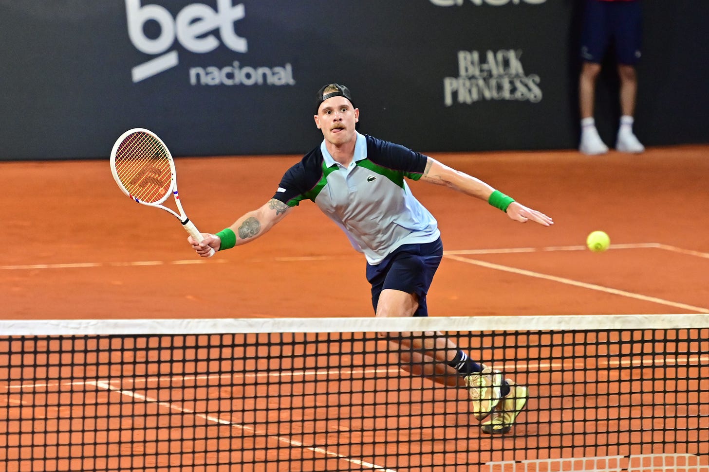 Karue Sell hitting a forehand volley on clay