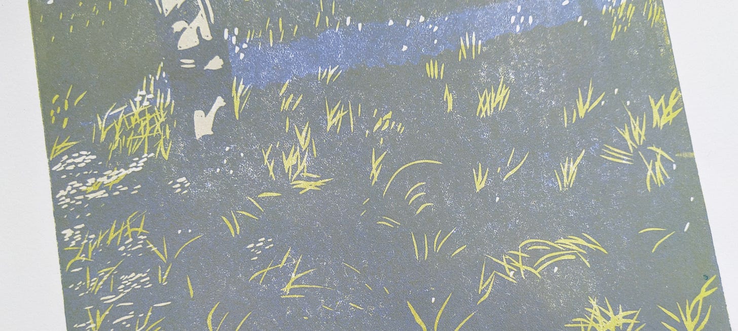 a largely grey image with a few bits of yellow and purple
