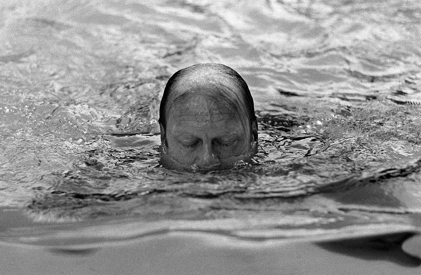 President Gerald Ford surfaces for air during a swim in the pool of his Alexandria, Va., home on August 11, 1974. President Gerald Ford surfaces for air during a swim in the pool of his Alexandria, Va., home on August 11, 1974.