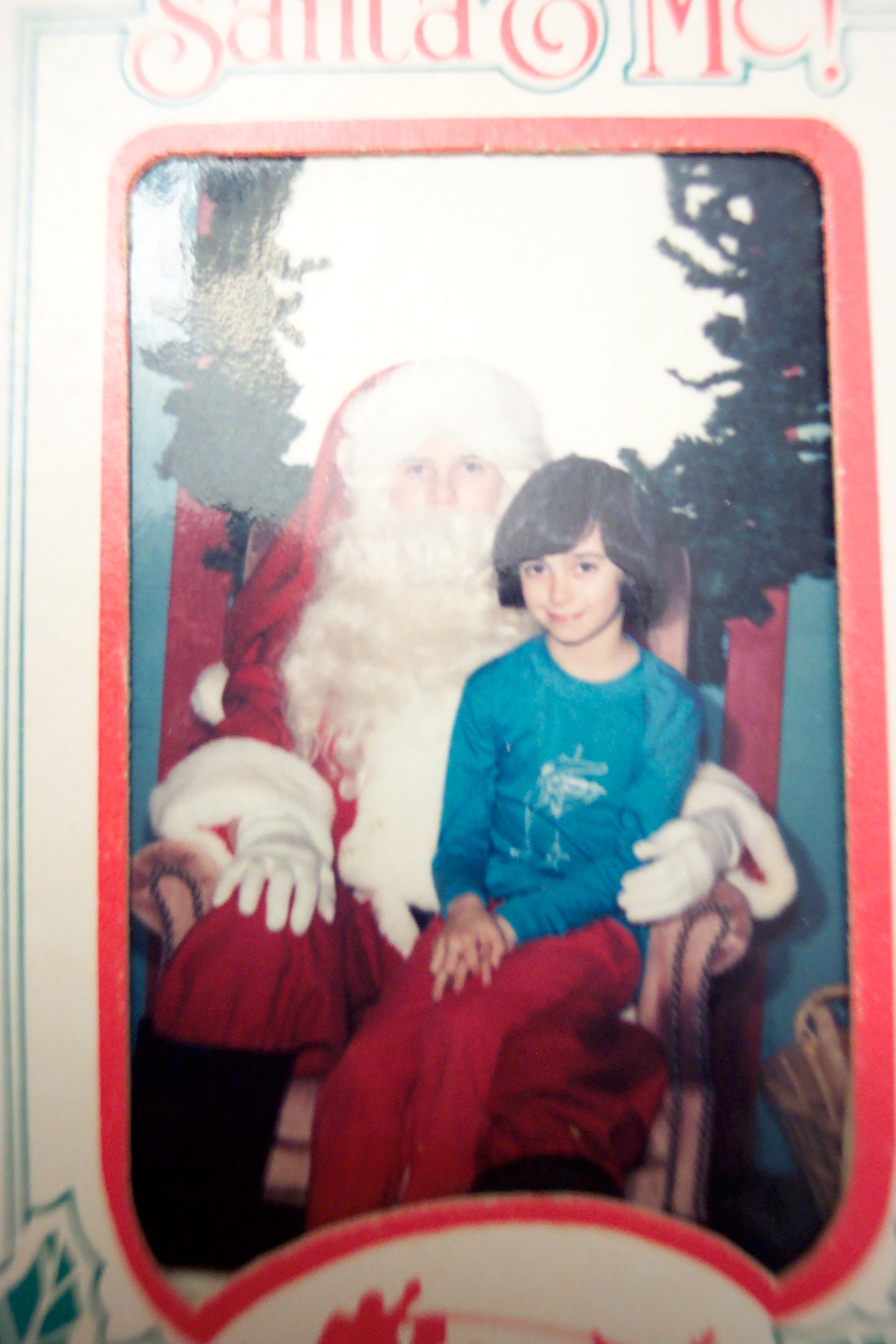 Amanda Troop as a girl sits on Santa's lap Amanda Troop as a girl sits on Santa's lap