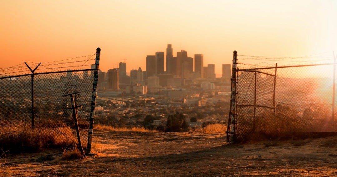 black metal fence near building during daytime black metal fence near building during daytime