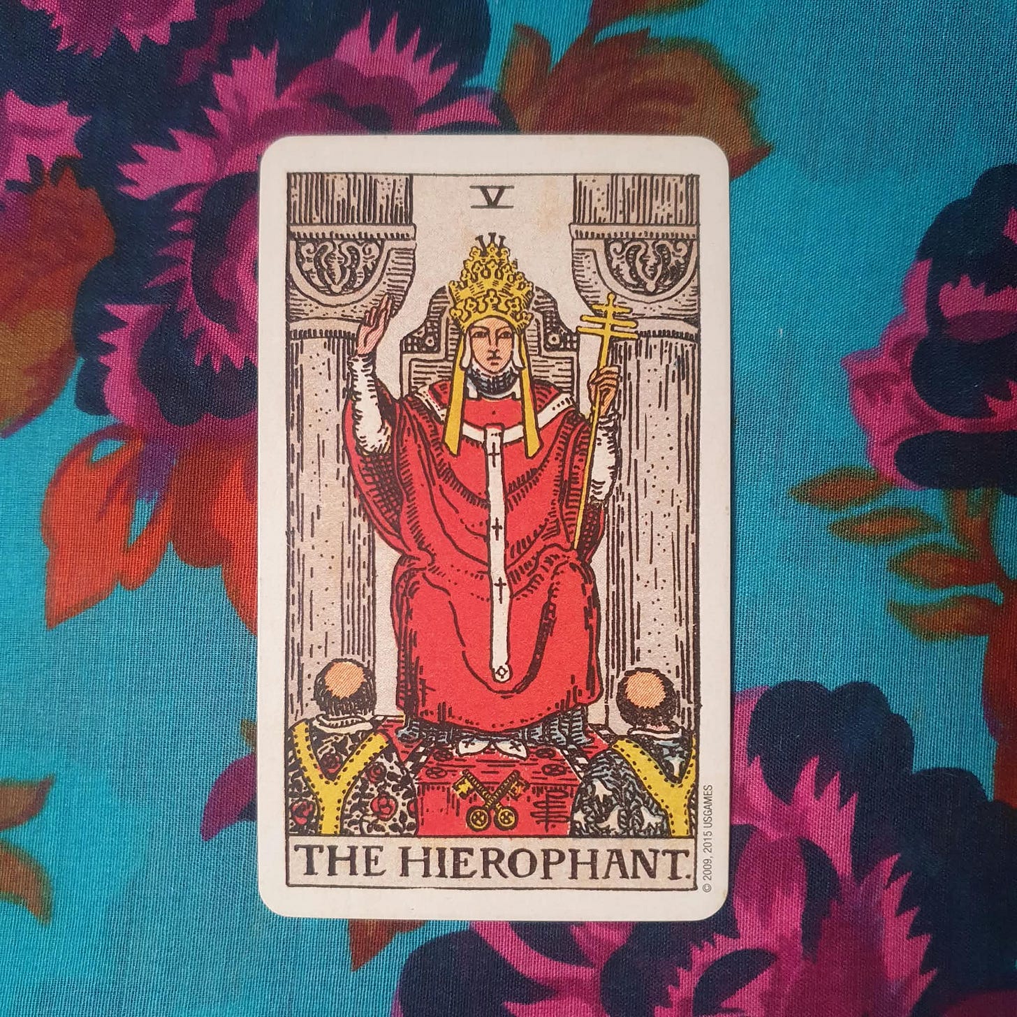 The Hierophant card drawn during Boo Miller’s Tarot DMs interview, photographed on bright turquoise floral fabric. The Hierophant card drawn during Boo Miller’s Tarot DMs interview, photographed on bright turquoise floral fabric.