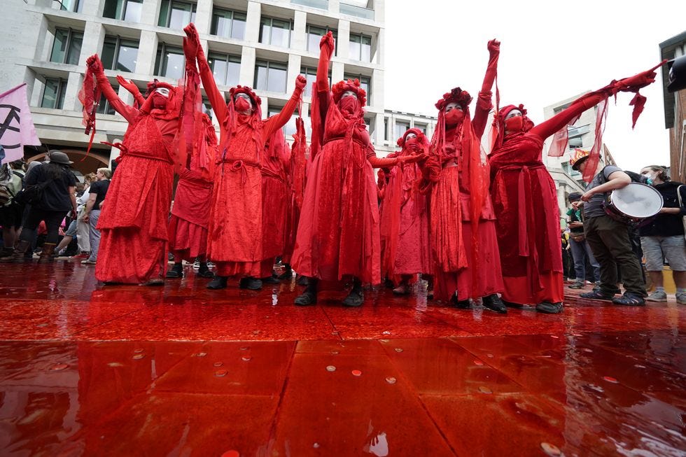Protesters throw red paint at Guildhall, taking aim at what Extinction Rebellion said is the City’s ongoing financing of the fossil fuel industry.