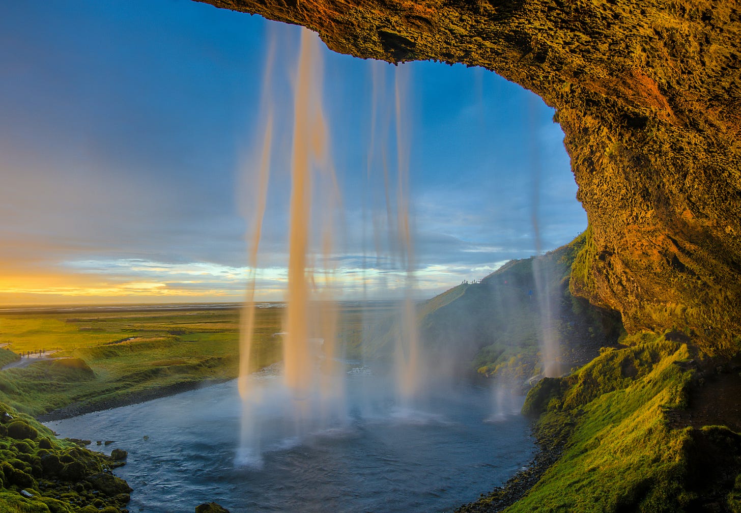 waterfalls under blue skies in Iceland