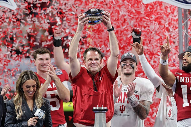 Head coach Curt Cignetti of the Indiana Hoosiers hoists the George P. Crumbley Trophy after defeating the Oregon Ducks in the 2025 College Football...