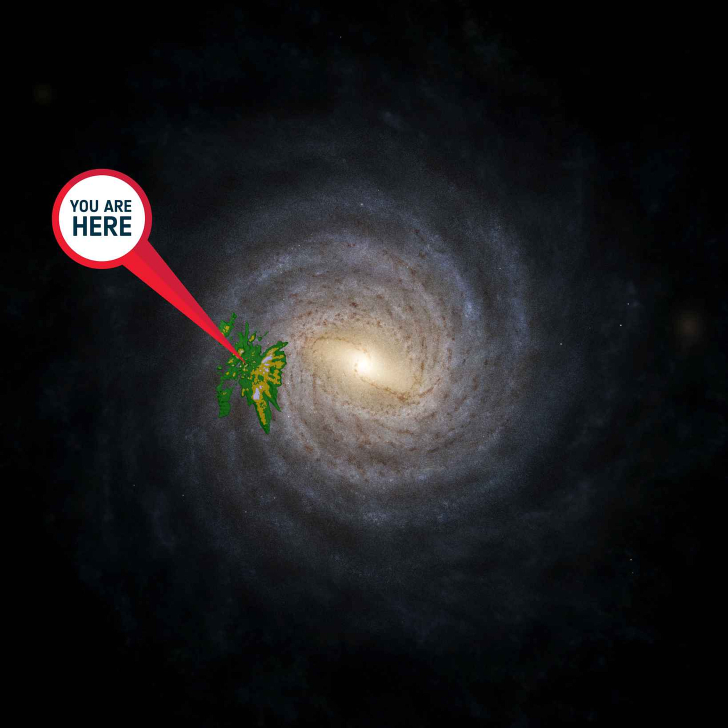 Image of the Milky Way spiral galaxy against a black background, with a red and white 'pin' that reads "you are here" 