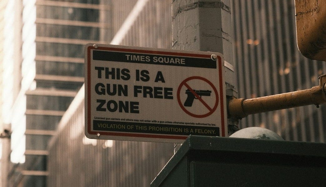 a sign on a pole on a city street