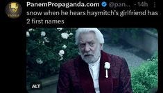 This may contain: an old man with white hair wearing a red jacket