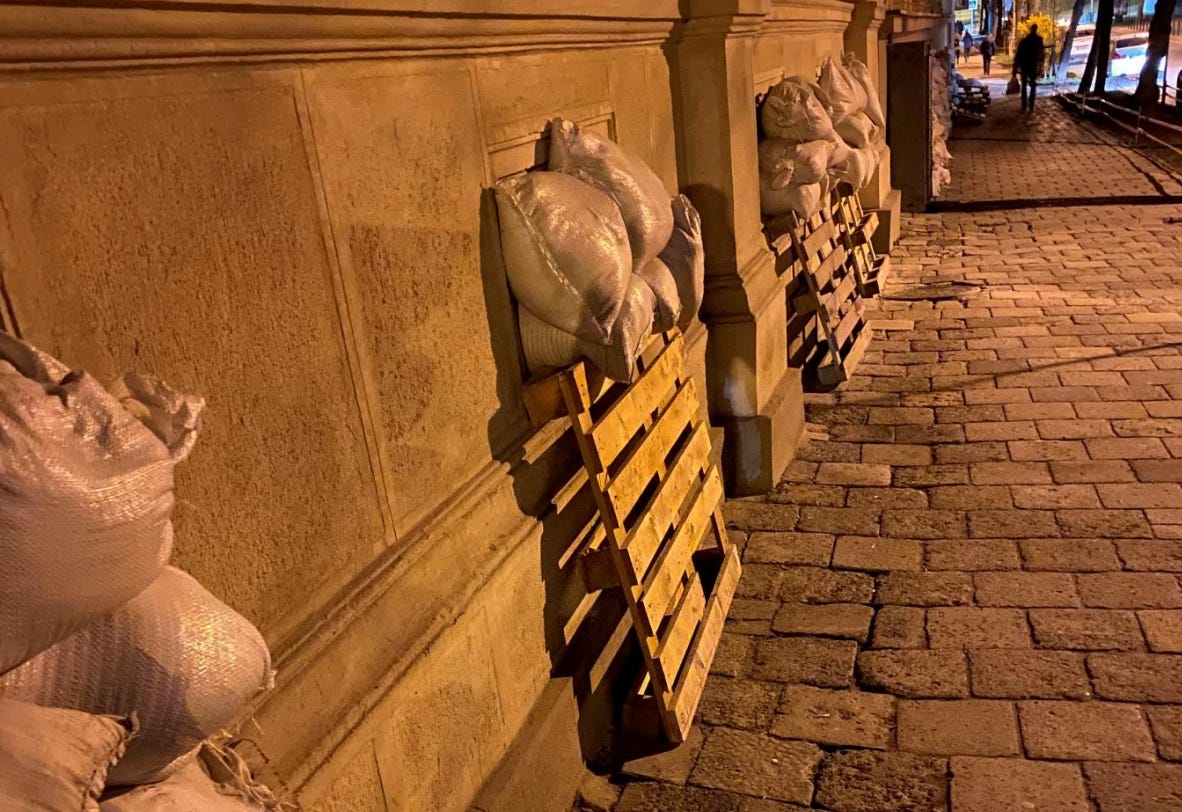 Sand bags and protection on windows on an old building